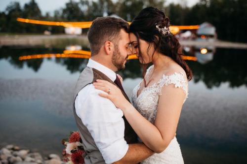 bride & groom overlooking pond