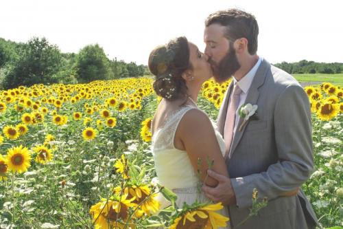 bride and groom sunflower field