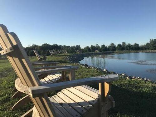 chairs overlooking pond